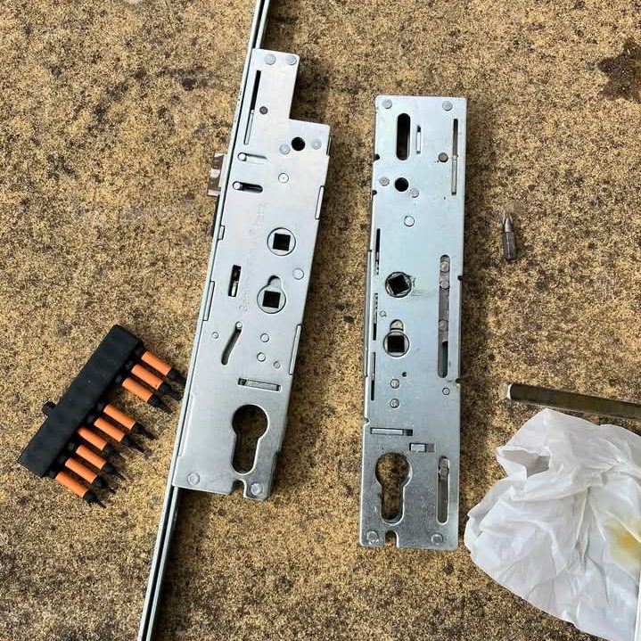 Multipoint door locking mechanism removed for repair