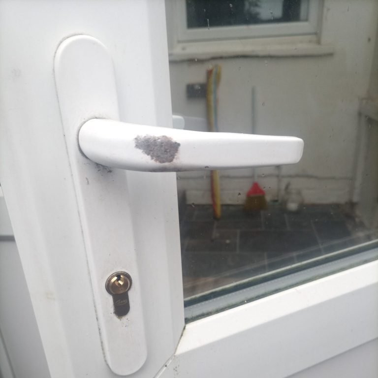 White uPVC door handle with euro cylinder lock